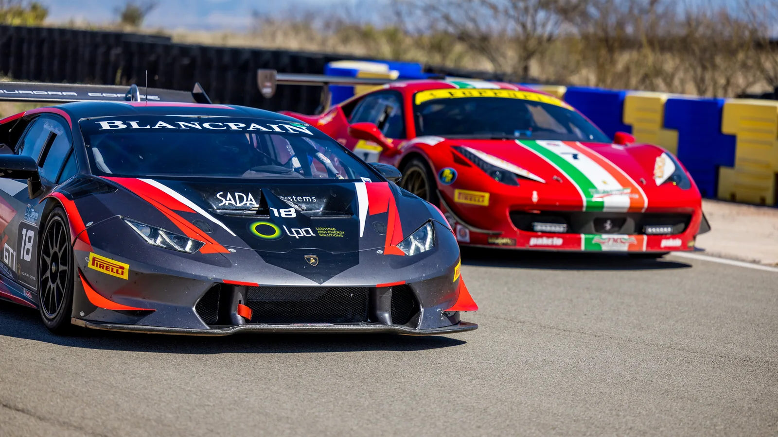 Number 18 Lamborghini leading a red Ferrari at INDE